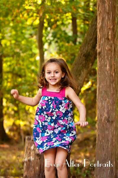 Little girl running outdoors.
