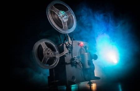 depositphotos_271625974-stock-photo-old-vintage-movie-projector-on